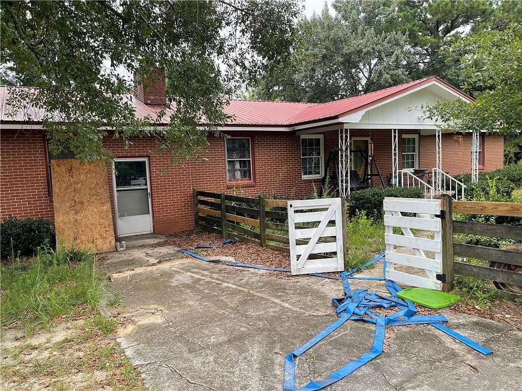 13.6 Acres of Land with Home for Sale in Reynolds, Georgia