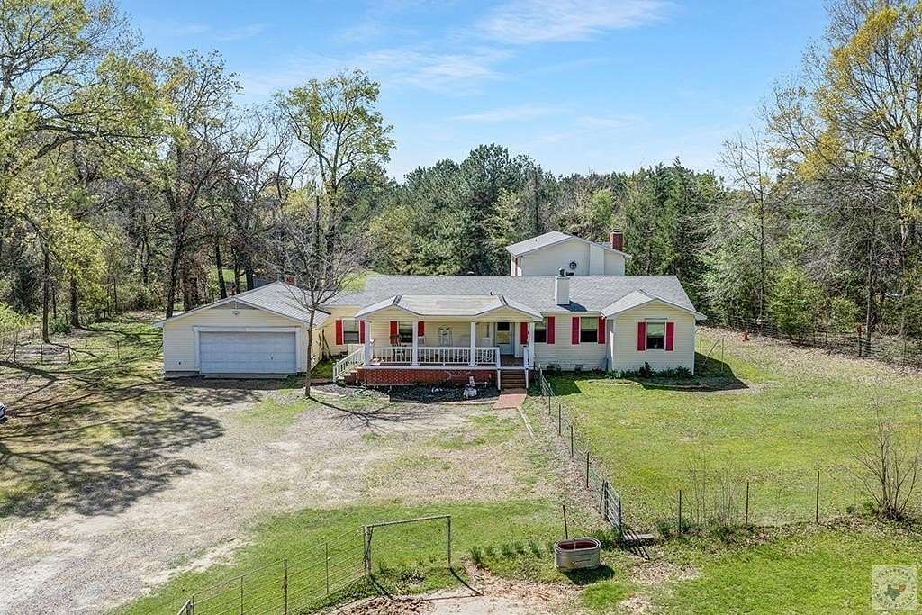 7.57 Acres of Land with Home for Sale in New Boston, Texas