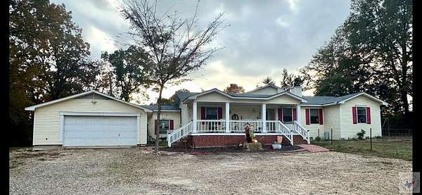 7.57 Acres of Land with Home for Sale in New Boston, Texas