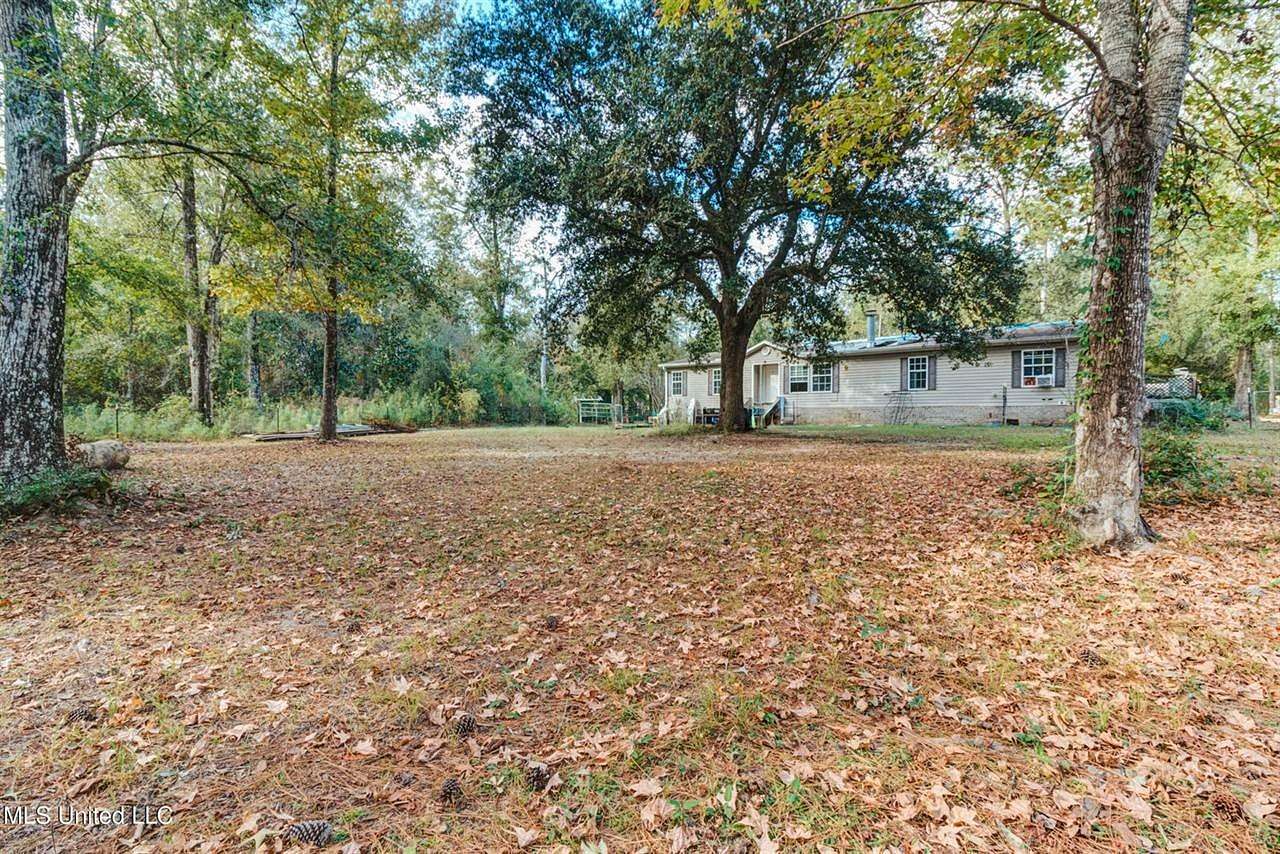 5.5 Acres of Residential Land with Home for Sale in Kiln, Mississippi