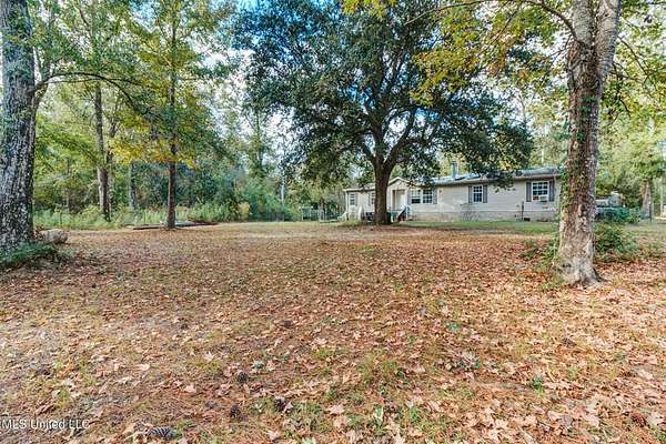5.5 Acres of Land with Home for Sale in Kiln, Mississippi