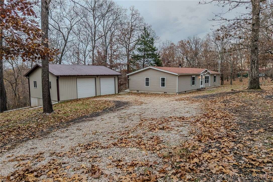 10.4 Acres of Land with Home for Sale in Gravois Mills, Missouri