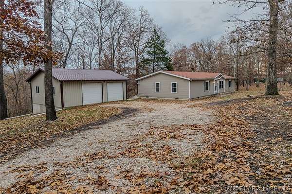10.4 Acres of Land with Home for Sale in Gravois Mills, Missouri