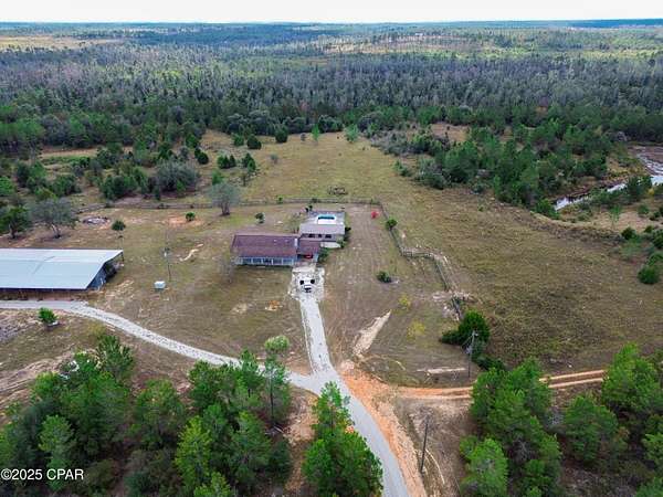 105 Acres of Land with Home for Sale in Altha, Florida