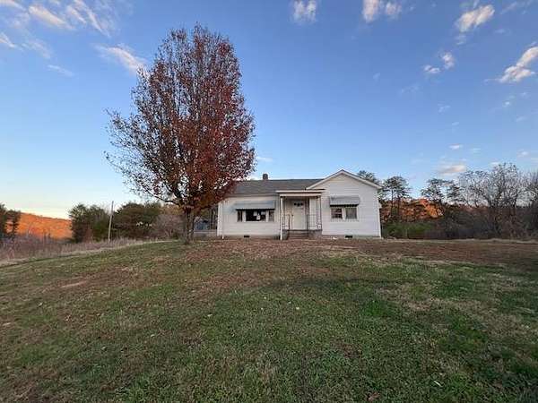 6.9 Acres of Residential Land with Home for Sale in Clifton, Tennessee