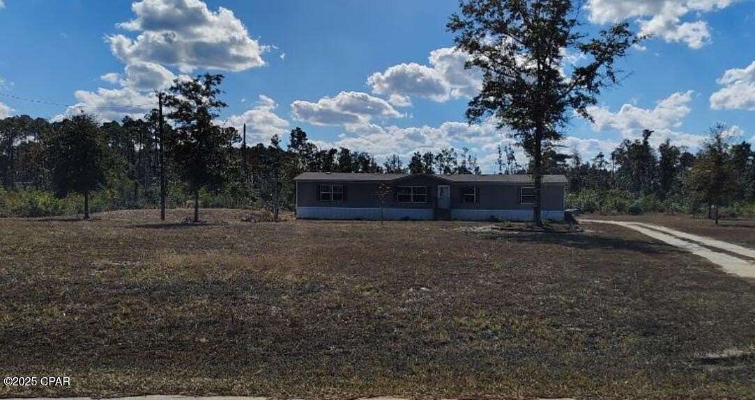 5 Acres of Residential Land with Home for Sale in Altha, Florida