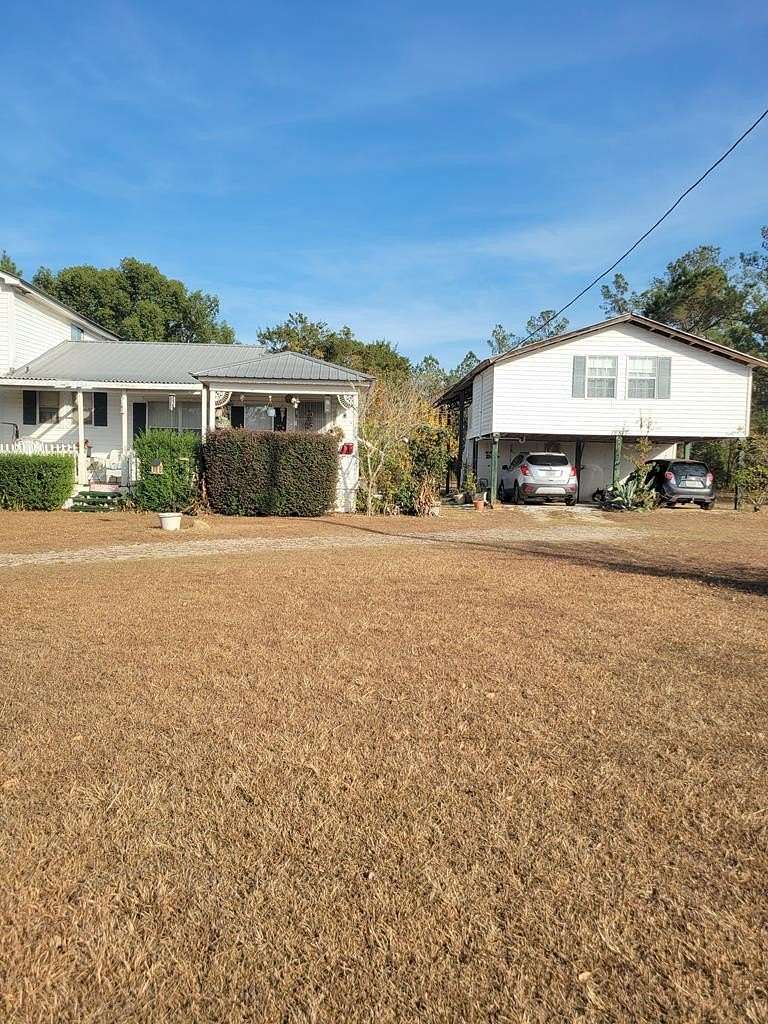 1.56 Acres of Land with Home for Sale in Blountstown, Florida