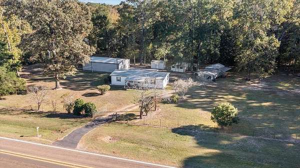 5.79 Acres of Land with Home for Sale in Hemphill, Texas