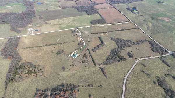 79.2 Acres of Agricultural Land with Home for Sale in Bolivar, Missouri
