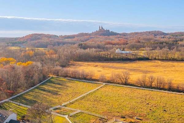 57.3 Acres of Agricultural Land with Home for Sale in Hartford, Wisconsin