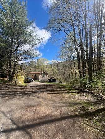 10.1 Acres of Recreational Land with Home for Sale in De Lancey, New York