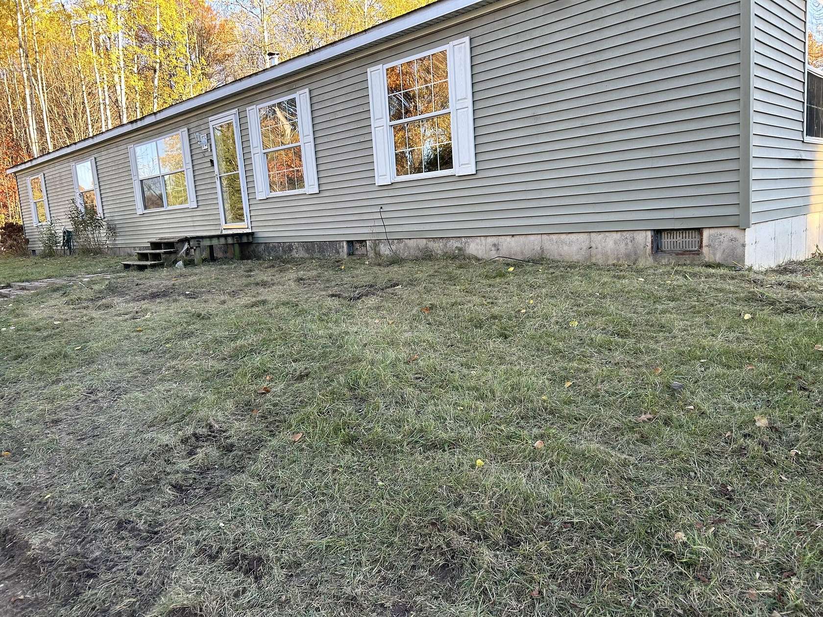 2 Acres of Residential Land with Home for Sale in Manton, Michigan