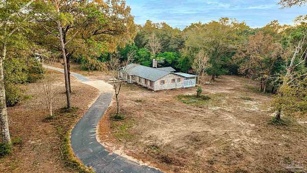 4 Acres of Residential Land with Home for Sale in Molino, Florida