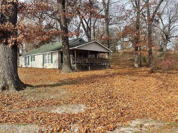 35 Acres of Recreational Land with Home for Sale in Granby, Missouri