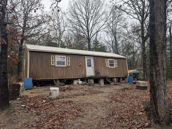 2.5 Acres of Residential Land with Home for Sale in Kissee Mills, Missouri