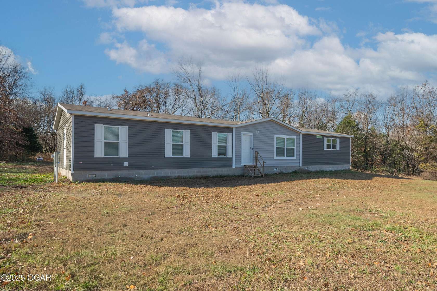 9 Acres of Residential Land with Home for Sale in Neosho, Missouri