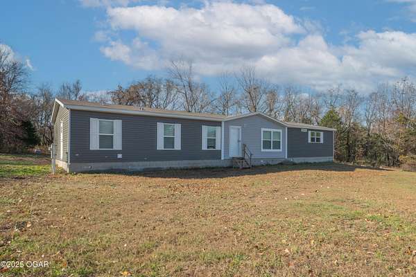 9 Acres of Residential Land with Home for Sale in Neosho, Missouri