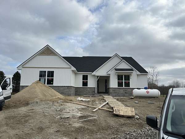 2.24 Acres of Residential Land with Home for Sale in New Hudson, Michigan