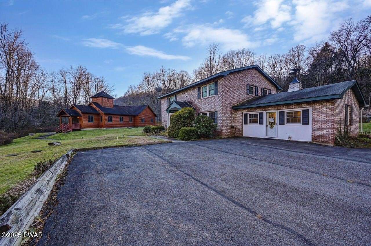 57.2 Acres of Land with Home for Sale in Starlight, Pennsylvania
