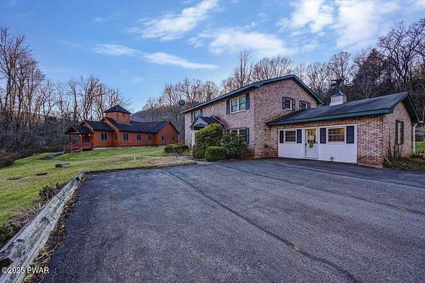 57.2 Acres of Land with Home for Sale in Starlight, Pennsylvania