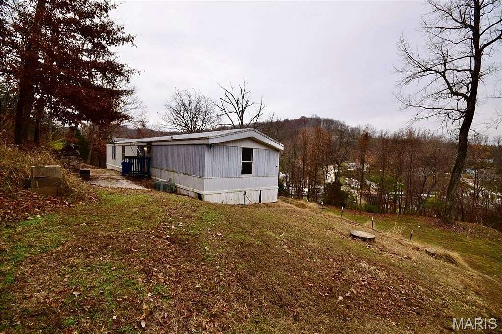 5.76 Acres of Residential Land with Home for Sale in House Springs, Missouri