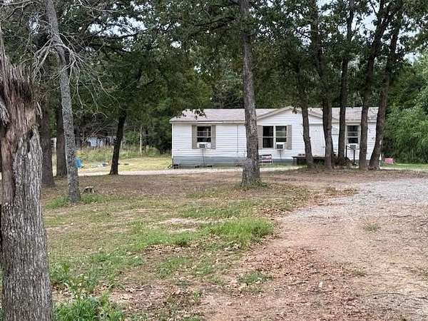 65 Acres of Land with Home for Sale in Holdenville, Oklahoma