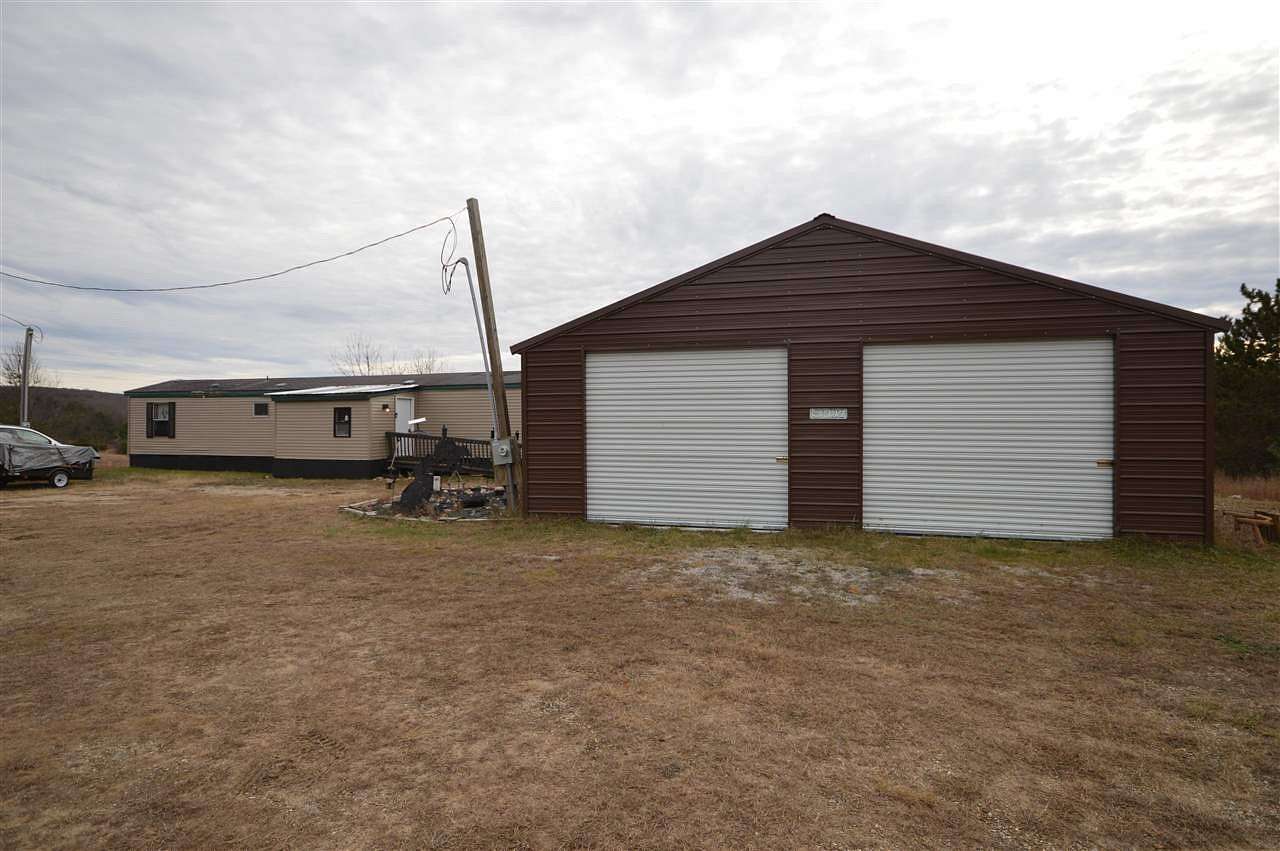 3.27 Acres of Residential Land with Home for Sale in Mancelona, Michigan