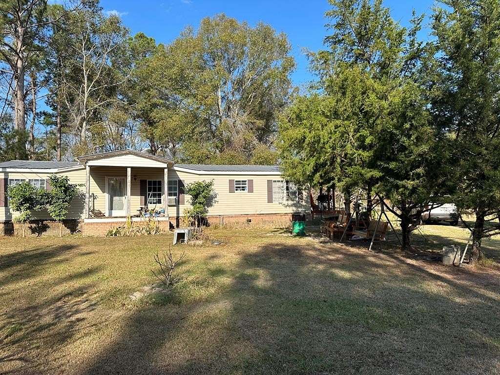 13.7 Acres of Land with Home for Sale in Lyons, Georgia