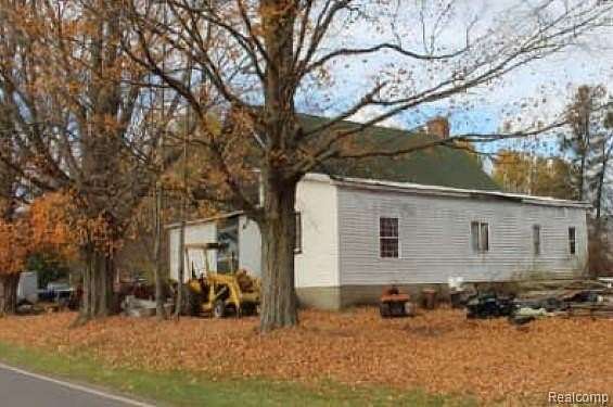 1.5 Acres of Residential Land with Home for Auction in Walkerville, Michigan