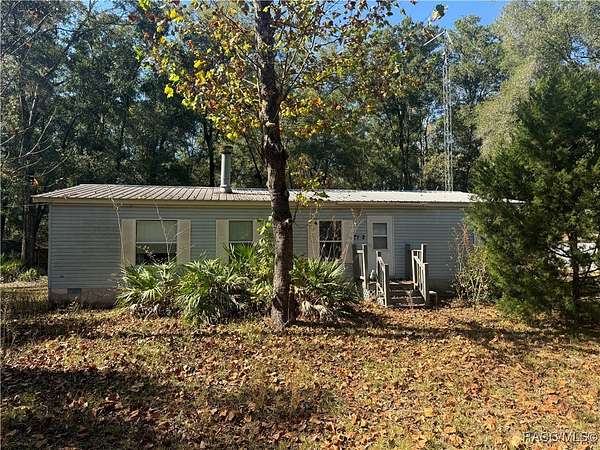 1.55 Acres of Residential Land with Home for Sale in Dunnellon, Florida