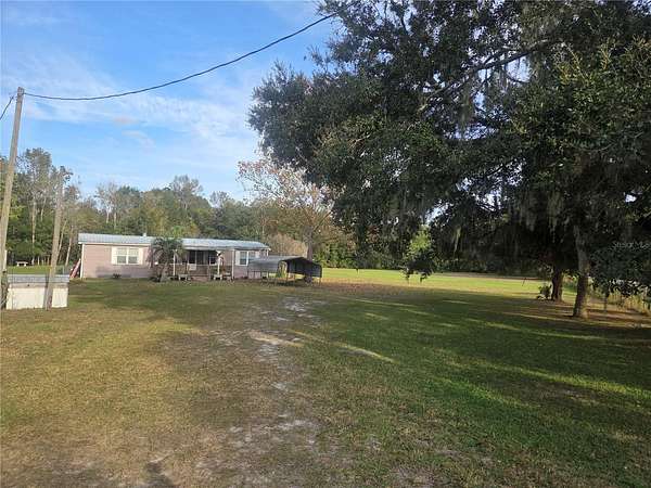 4 Acres of Residential Land with Home for Sale in De Leon Springs, Florida