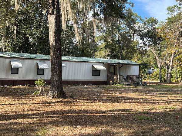 2 Acres of Residential Land with Home for Sale in Chiefland, Florida