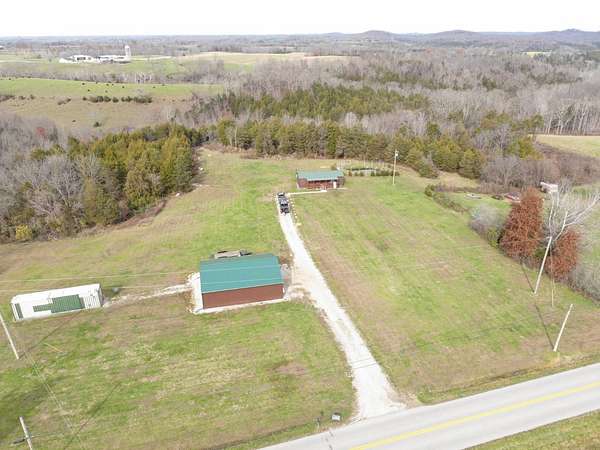 90 Acres of Land with Home for Sale in Tollesboro, Kentucky