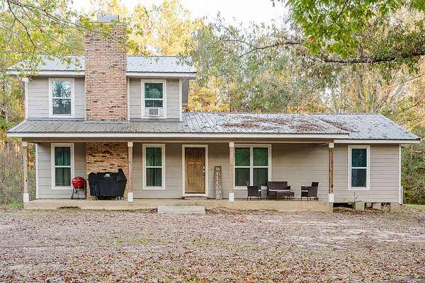 27.6 Acres of Agricultural Land with Home for Sale in Florien, Louisiana