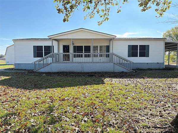 5 Acres of Residential Land with Home for Sale in Combine, Texas