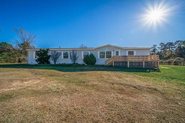 5.42 Acres of Residential Land with Home for Sale in Tatum, Texas