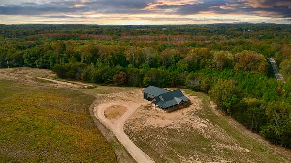 31.7 Acres of Land with Home for Sale in Buena Vista, Tennessee