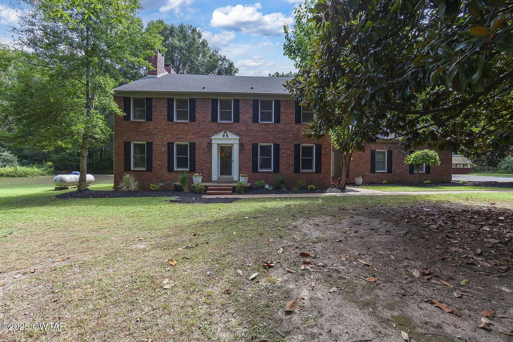 3.8 Acres of Residential Land with Home for Sale in Jackson, Tennessee