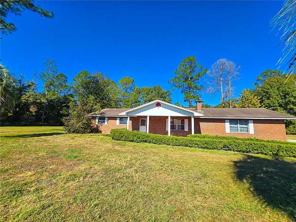 12.9 Acres of Land with Home for Sale in Hampton, Florida