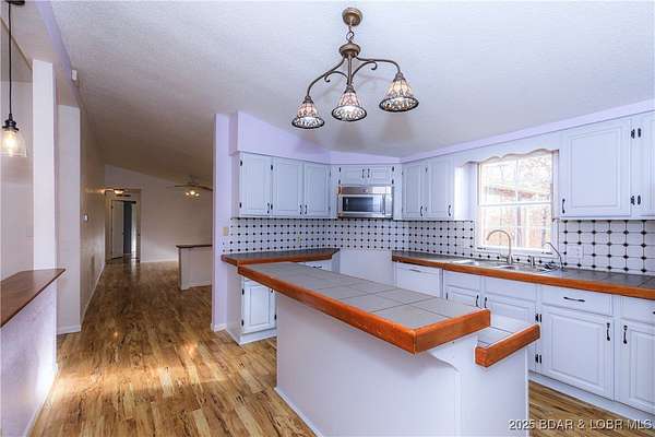 1.5 Acres of Residential Land with Home for Sale in Linn Creek, Missouri