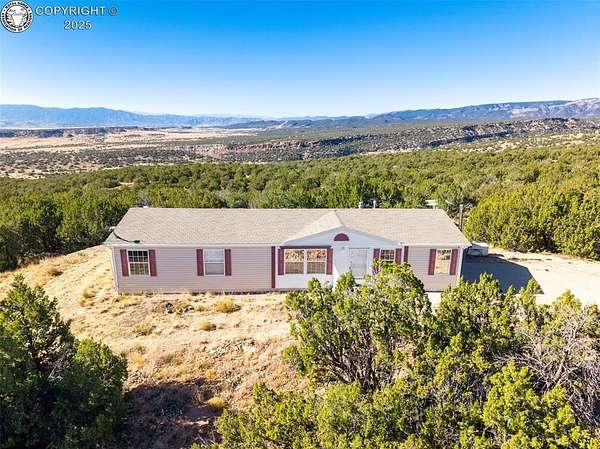 35.5 Acres of Agricultural Land with Home for Sale in Penrose, Colorado