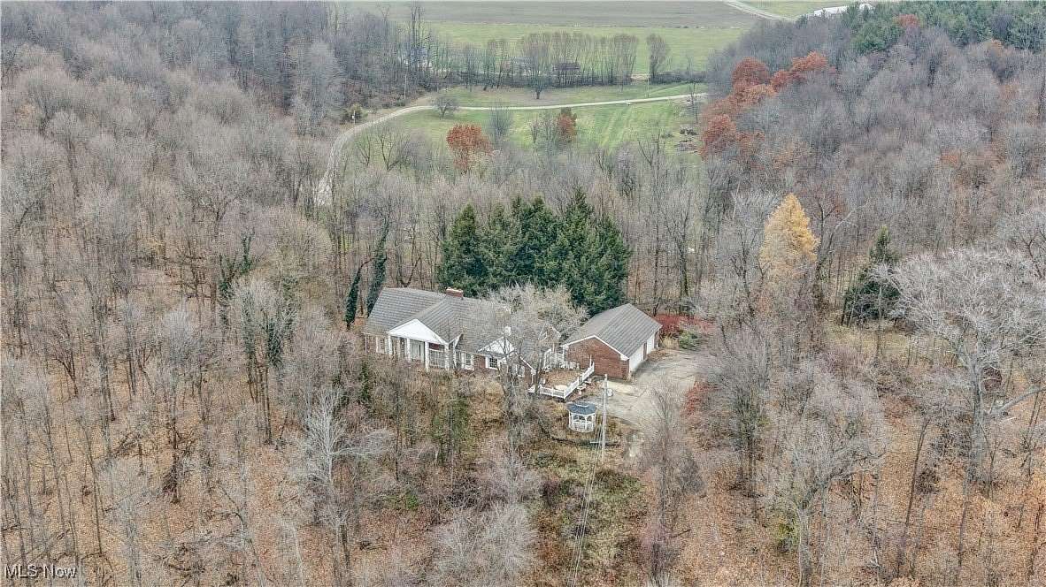 10.4 Acres of Land with Home for Auction in Minerva, Ohio