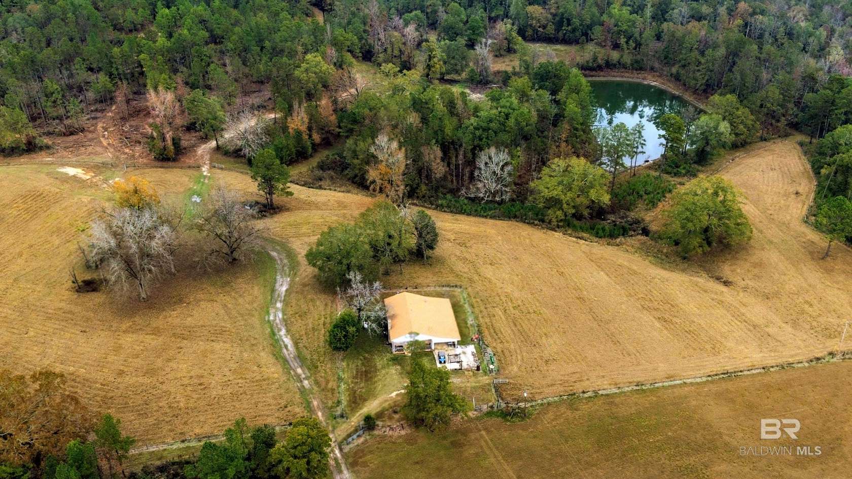 153 Acres of Land with Home for Sale in Millry, Alabama