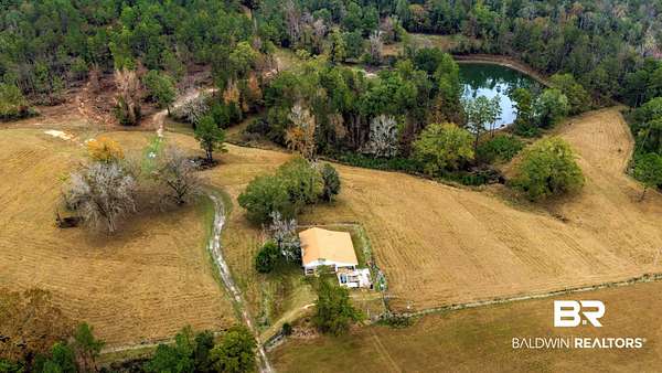 153 Acres of Land with Home for Sale in Millry, Alabama