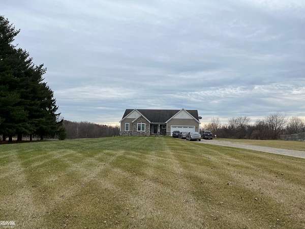 6.26 Acres of Residential Land with Home for Sale in Riley Township, Michigan