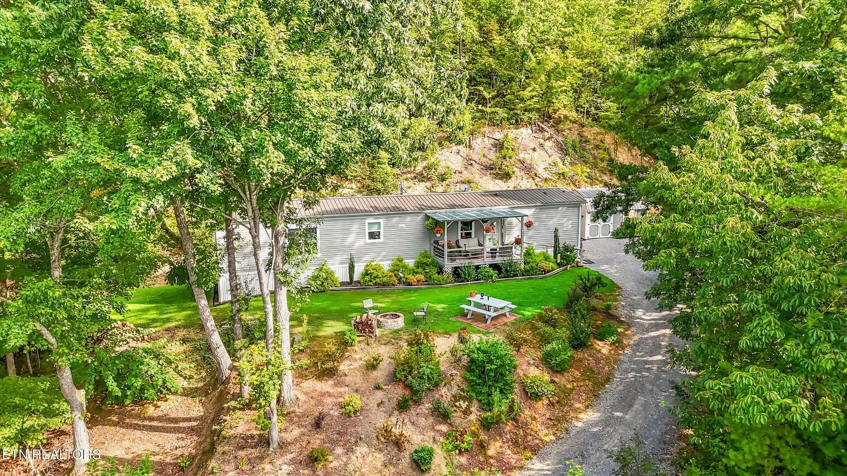 3.8 Acres of Residential Land with Home for Sale in Sevierville, Tennessee