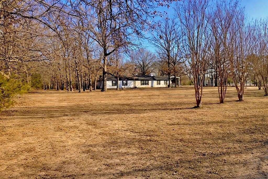 4 Acres of Residential Land with Home for Sale in Powderly, Texas