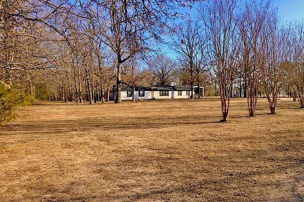4 Acres of Residential Land with Home for Sale in Powderly, Texas