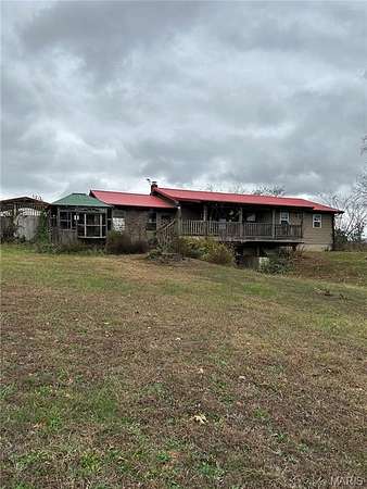 7.3 Acres of Residential Land with Home for Sale in De Soto, Missouri