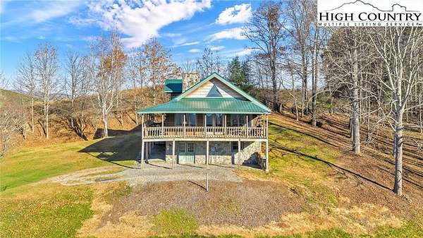 3.1 Acres of Residential Land with Home for Sale in Grassy Creek, North Carolina